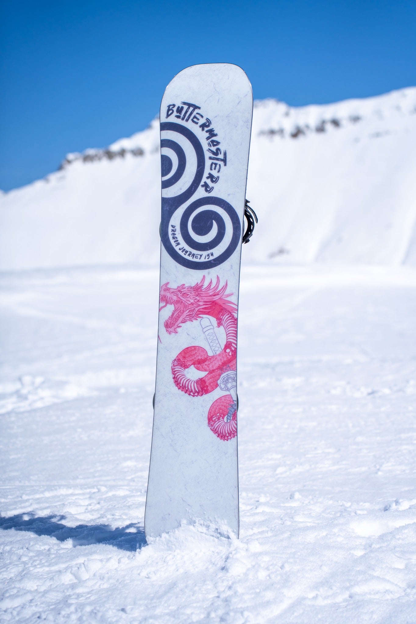 Dragon Journey snowboard standing in the snow